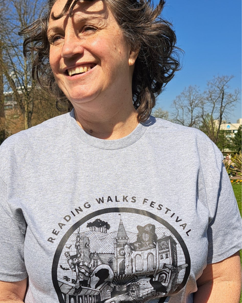 Woman wearing walks festival tshirt in grey