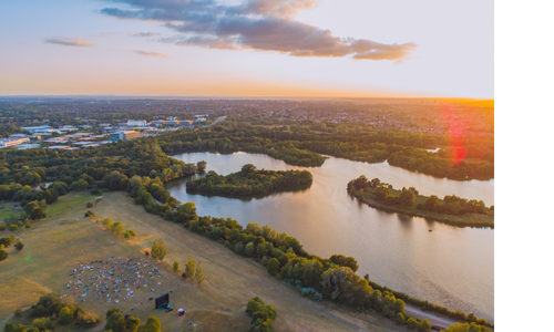 Dinton Pastures aerial view including lake and green space