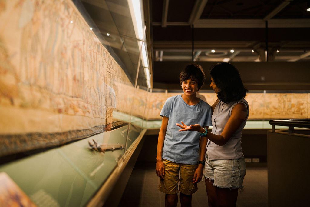 Mother and son looking at the Bayeux Tapestry in Reading Museum