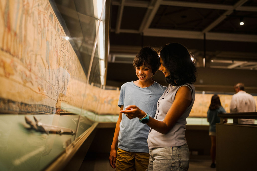 Mum and son looking at Reading's Bayeux Tapestry