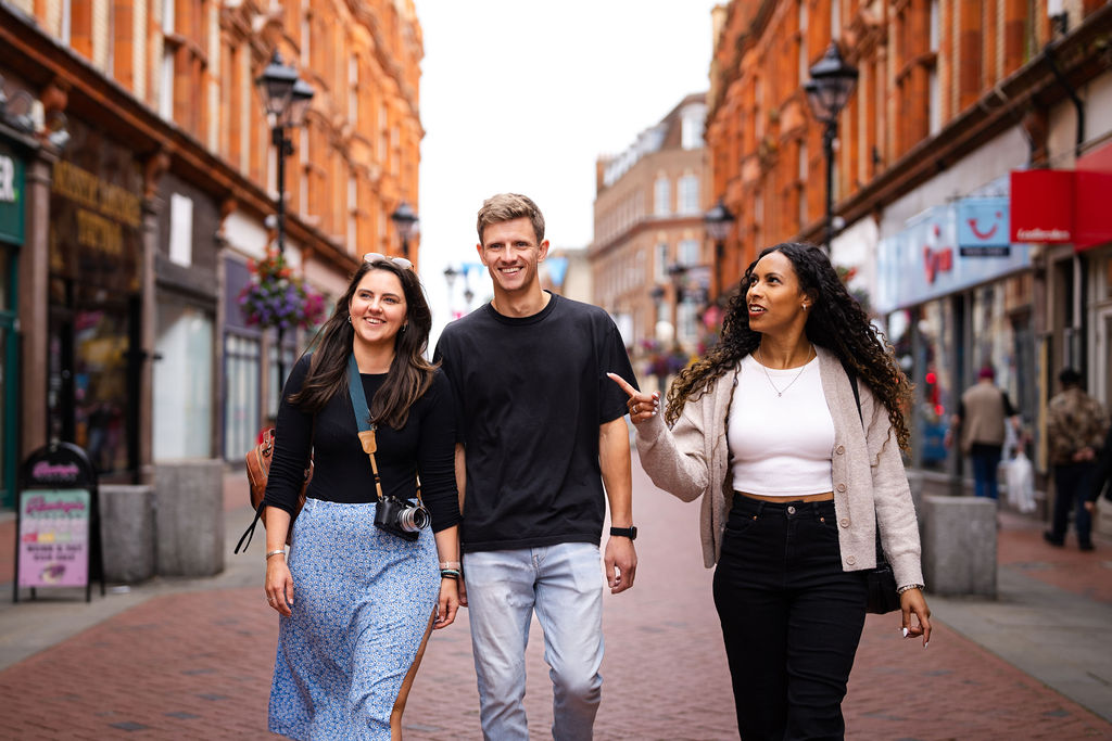 Group of young friends walking through Reading town centre