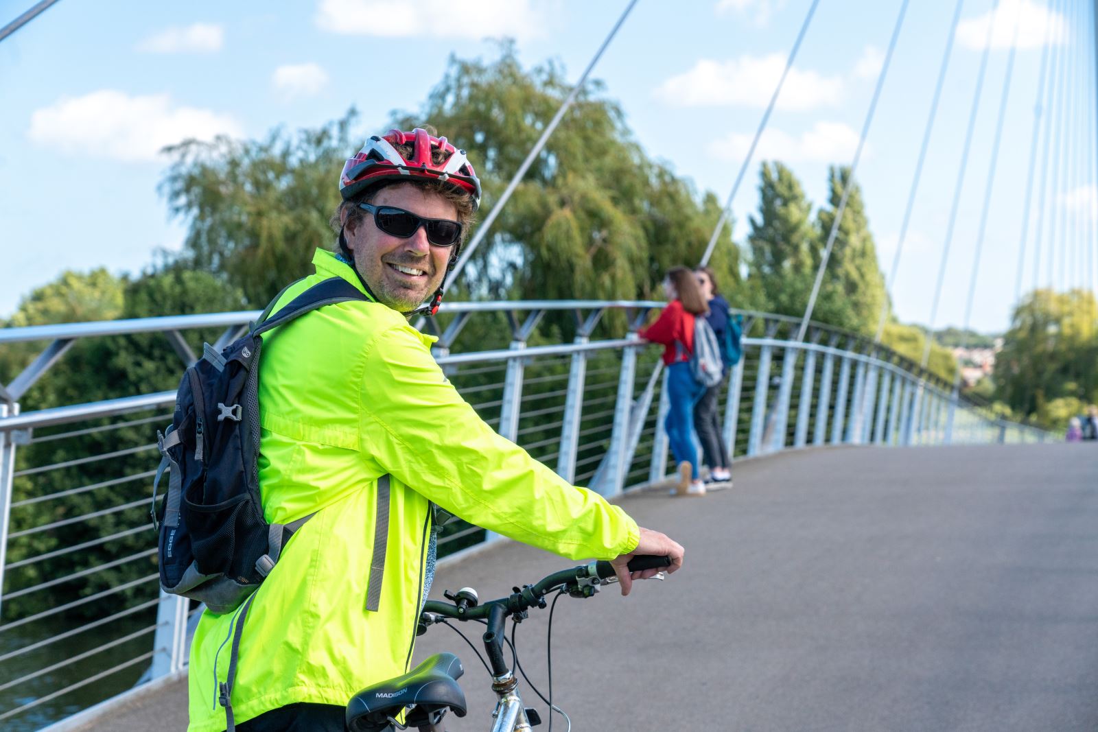 Cyclist in hi-vis on bridge